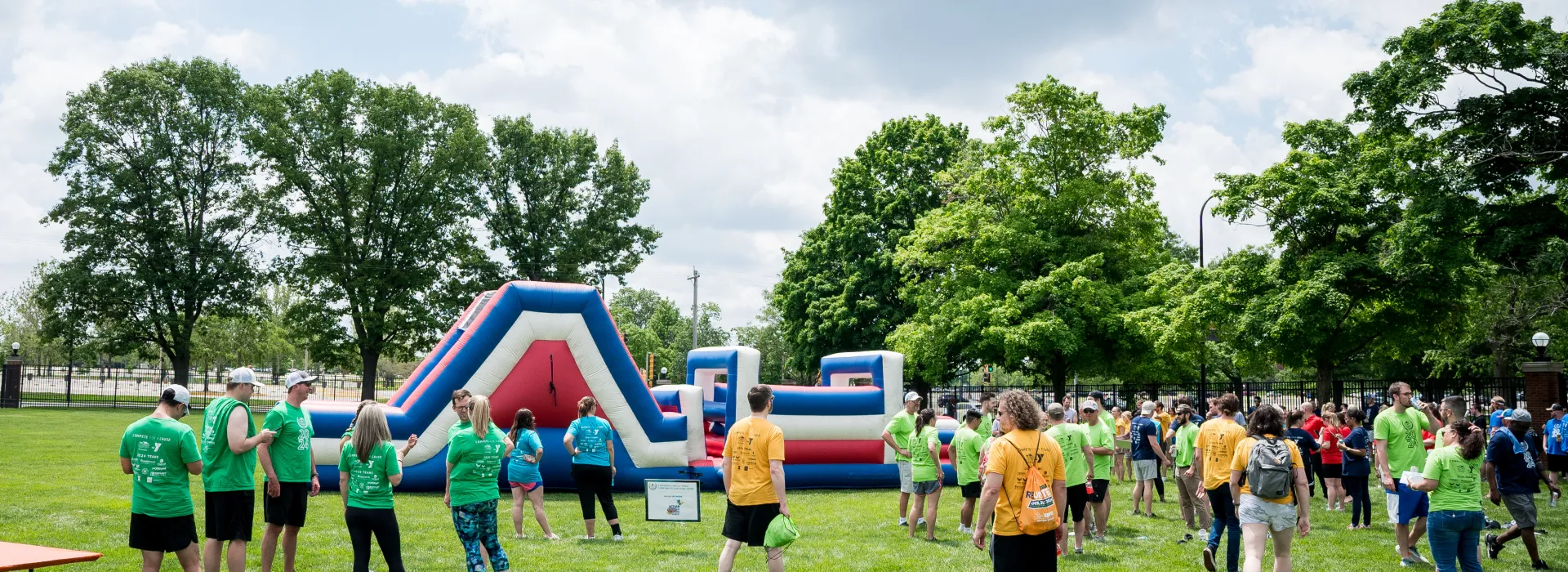 Teams standing near a large inflatable relay