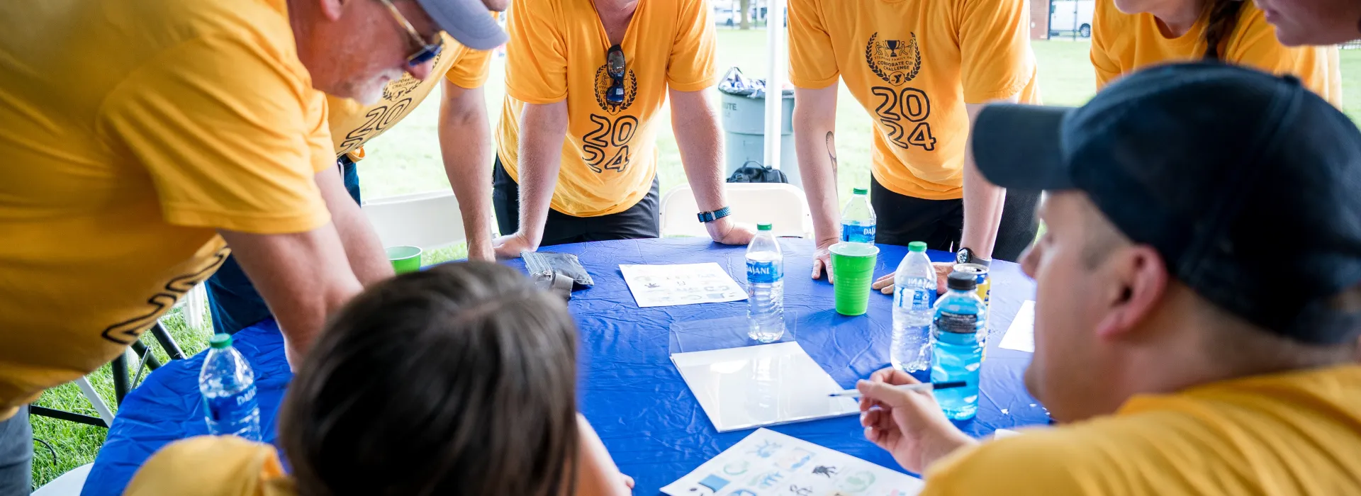 yellow team around a table playing trivia