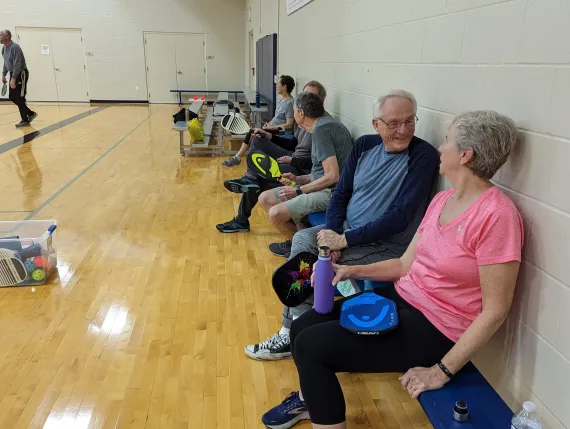 group waiting to play pickleball